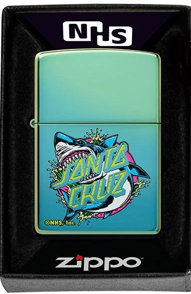 A Zippo lighter with a high polish teal finish featuring the iconic Santa Cruz Shark graphic.